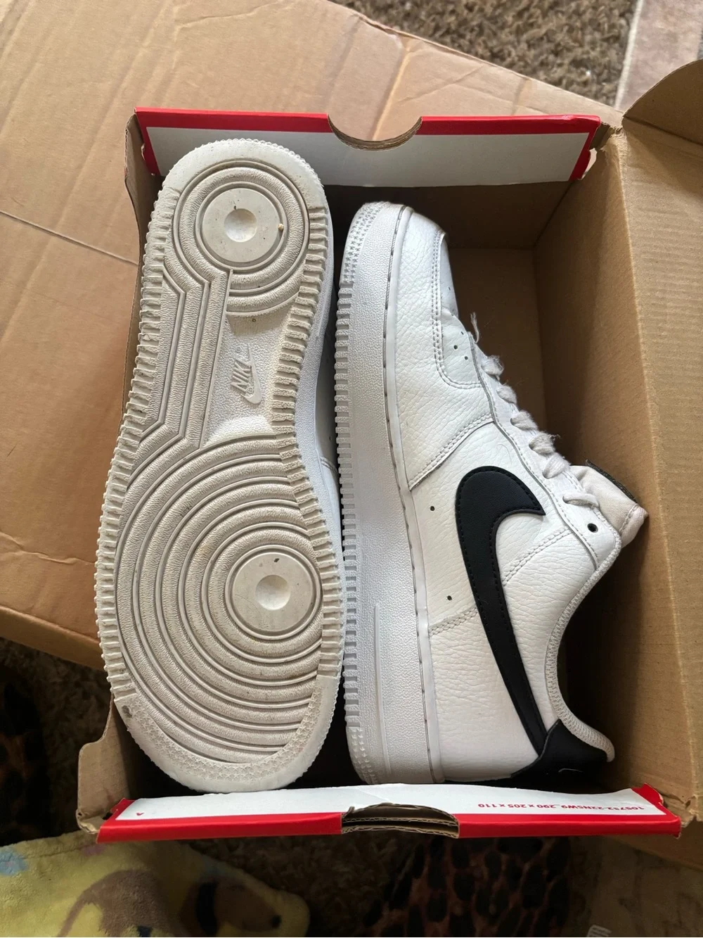 Nike White Low-Top Sneakers with Black Swoosh